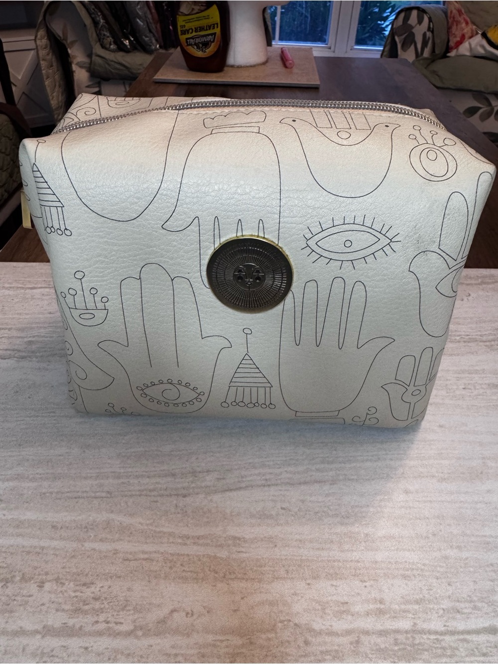 Cream Cosmetic Pouch with Hand & Eye Motif—highly sought after